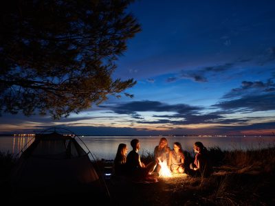 friends-gather-at-a-campfire